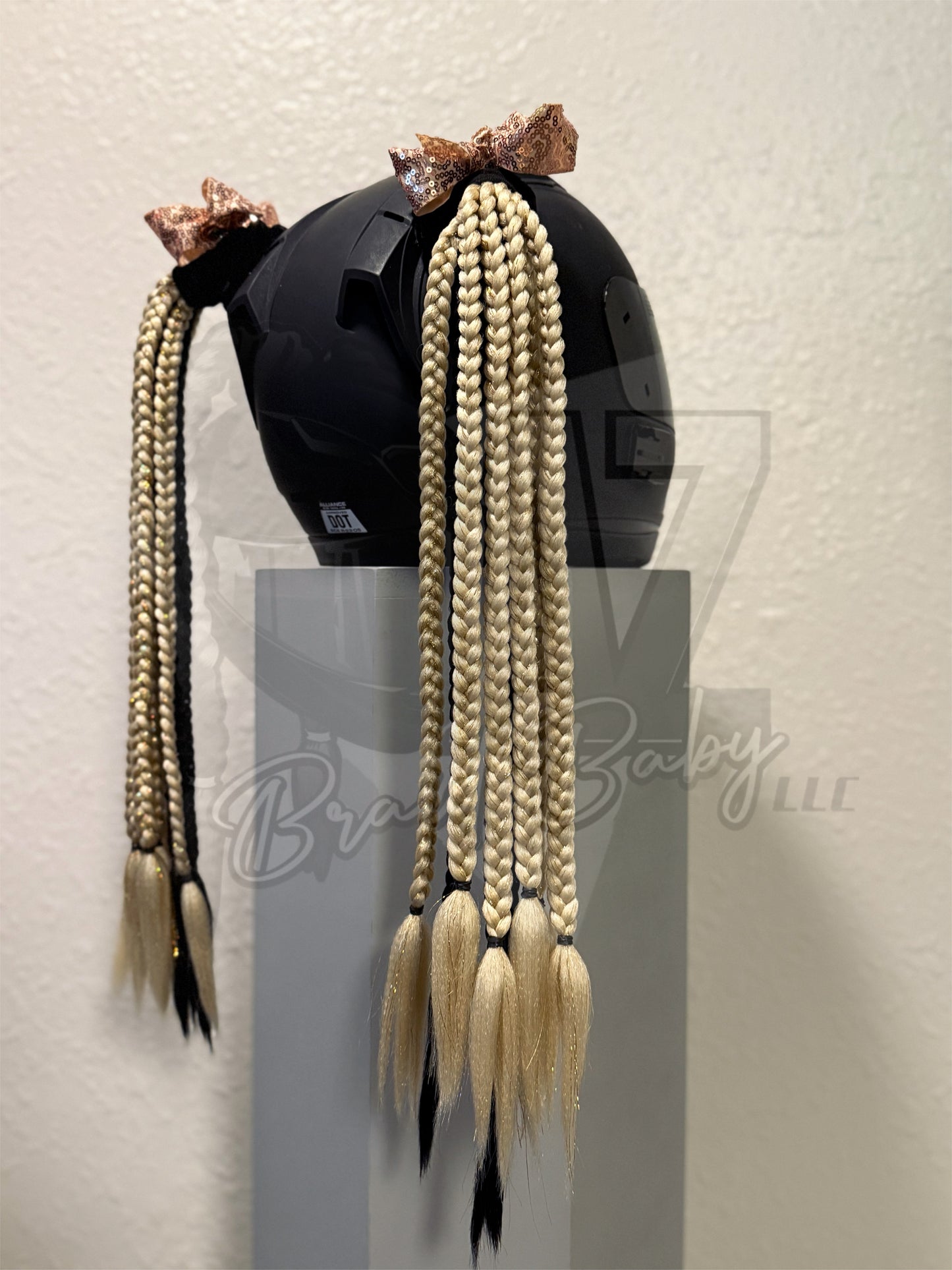 Custom motorcycle helmet braids featuring gold and black braids with color matching tinsel and sequin bows 
